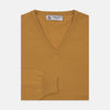 View 1 of product A Sunflower Yellow V-Neck Cashmere Jumper by Turnbull & Asser is neatly folded on a white background, with ribbed cuffs and a visible branded collar label, showcasing this luxurious knitwear piece.