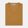 View 1 of product The Sunflower Yellow V-Neck Cashmere Slipover by Turnbull & Asser is neatly folded on a white background, showing the front and label—ideal for formal layering or as a versatile cashmere addition to your wardrobe.