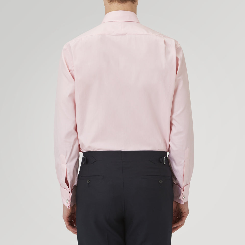 The Turnbull & Asser Pink Superfine Oxford Cotton Shirt features a T&A collar, double cuffs, and white buttons, neatly folded against a plain white background.