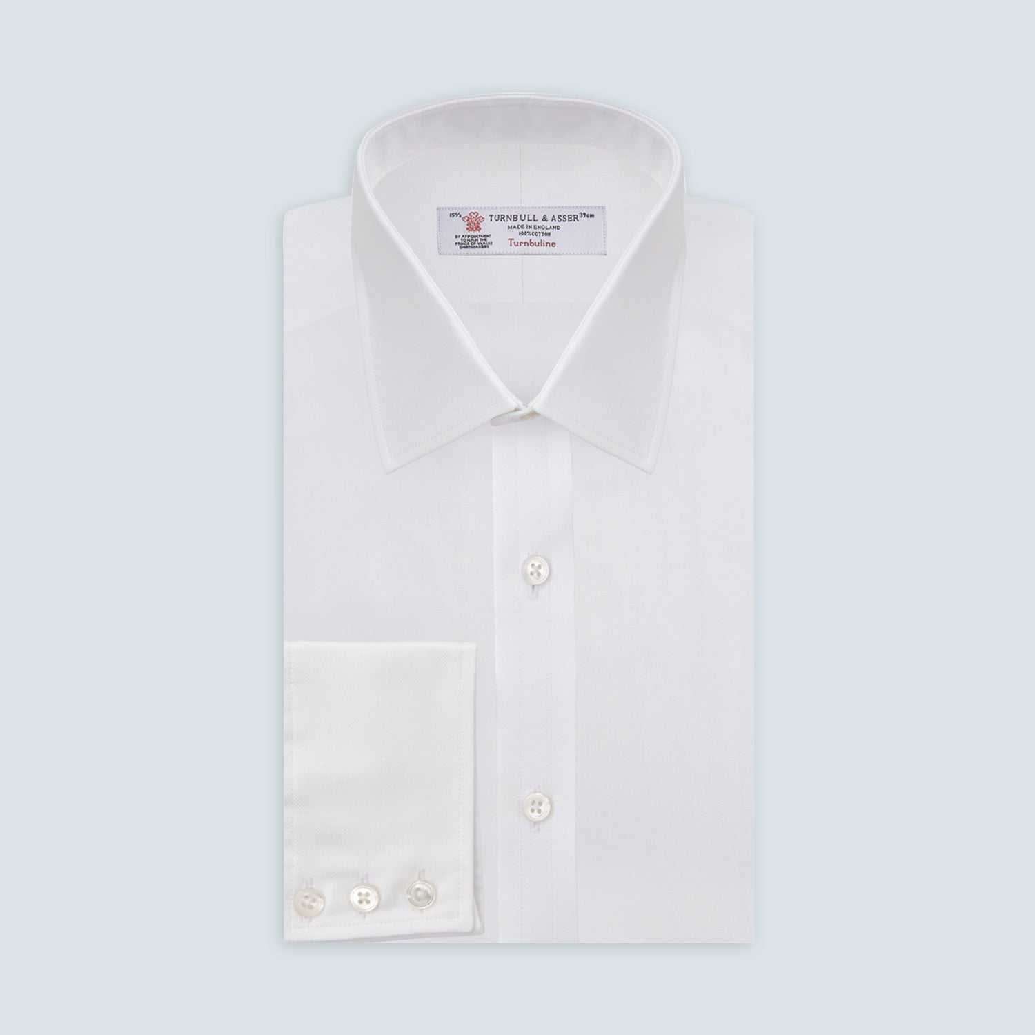 View 1 of product The Turnbull & Asser White Superfine Oxford Cotton Shirt features a T&A collar and 3-button cuffs, elegantly displayed against a light grey background.