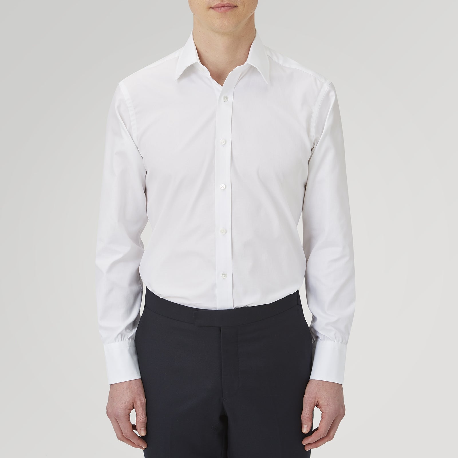 View 2 of product The Turnbull & Asser White Superfine Oxford Cotton Shirt features a T&A collar and 3-button cuffs, elegantly displayed against a light grey background.