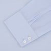 View 4 of product Turnbull & Asser's Tailored Fit Two-Fold 120 Light Blue Shirt features a classic Kent collar, white buttons, long sleeves with 2-button cuffs, and an inner collar label.