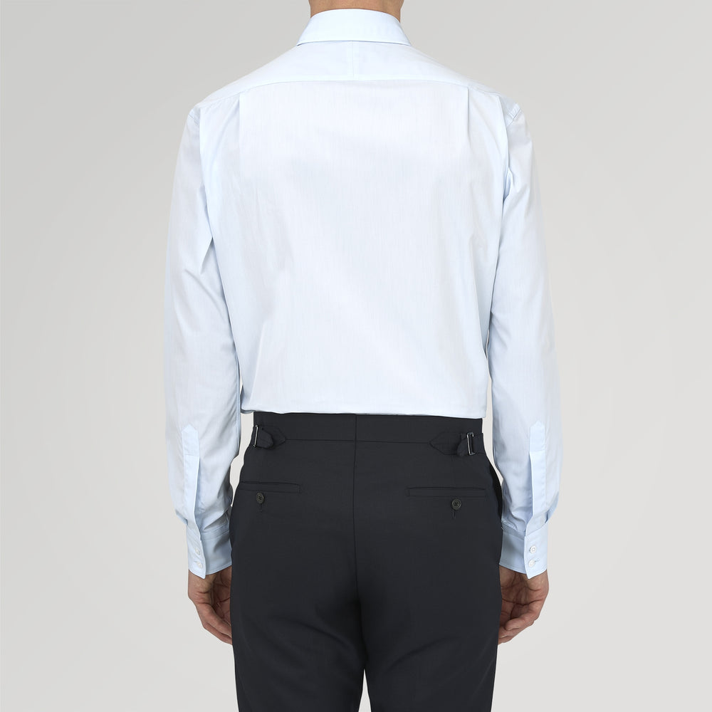 Turnbull & Asser's Tailored Fit Two-Fold 120 Light Blue Shirt features a classic Kent collar, white buttons, long sleeves with 2-button cuffs, and an inner collar label.