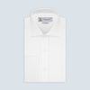 View 1 of product A neatly folded Turnbull & Asser Tailored Fit White Marcella Front Shirt with a Kent collar and double cuffs is displayed against a light grey background, with the label inside the collar visible.