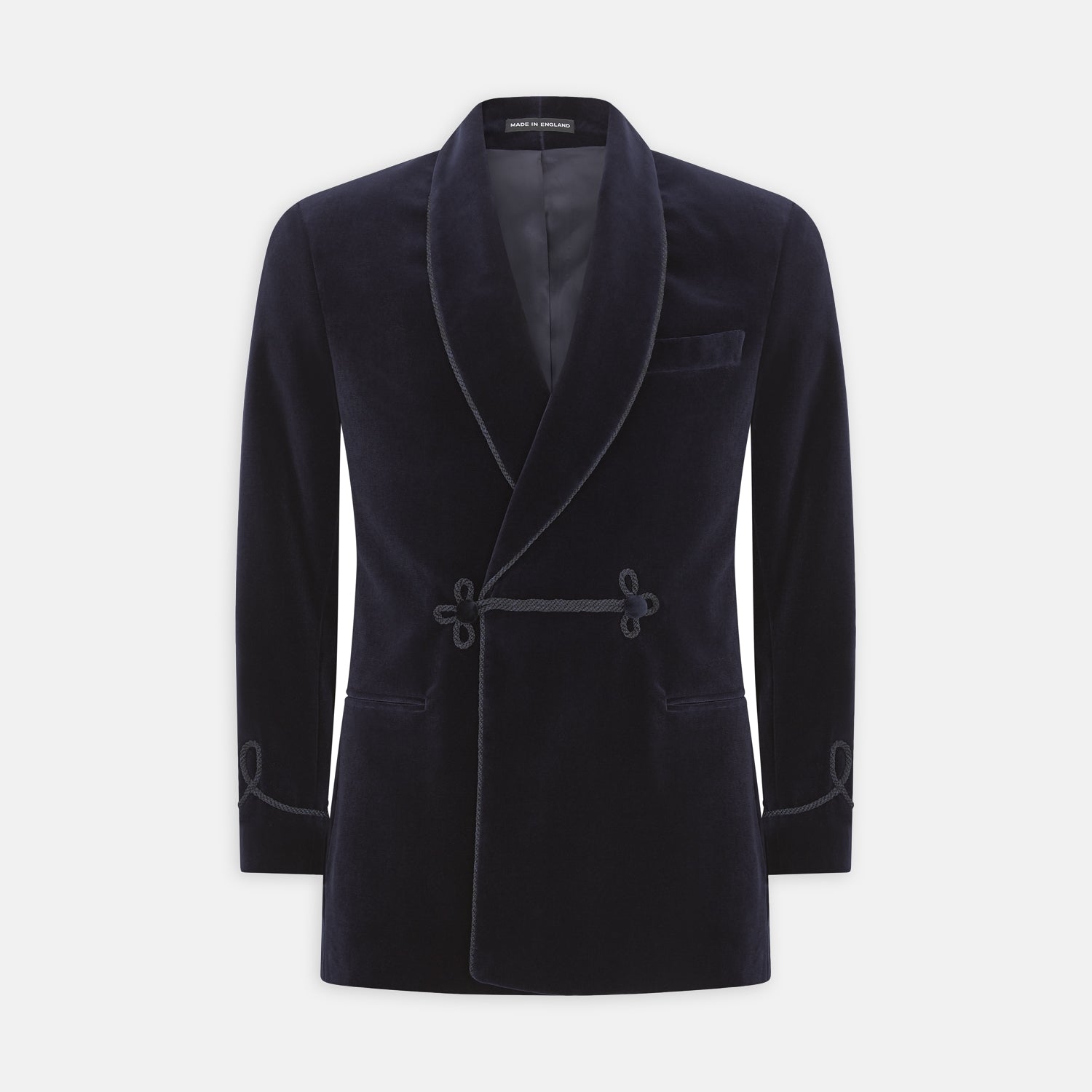 View 2 of product The Turnbull & Asser Navy Double Breasted Velvet Smoking Jacket features a shawl collar, corded closures on the front and cuffs, and a chest pocket, shown against a light gray background.