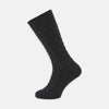 View 1 of product A Charcoal Cable Knit Cashmere Sock by Turnbull & Asser, featuring a ribbed cuff, is shown against a plain white background.