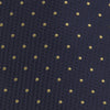 View 3 of product The Turnbull & Asser Navy and Gold Spot Lace Silk Tie, ideal for office wear, is shown rolled up on a white background.