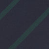 View 3 of product The Turnbull & Asser Navy and Green Blazer Stripe Repp Silk Tie features diagonal green stripes on navy silk, shown rolled at one end against a white background.