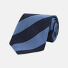 View 1 of product The Turnbull & Asser Navy and Blue Block Stripe Repp Silk Tie features wide navy and blue diagonal stripes on luxurious textured silk, elegantly presented against a white background.