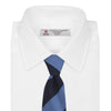 View 2 of product The Turnbull & Asser Navy and Blue Block Stripe Repp Silk Tie features wide navy and blue diagonal stripes on luxurious textured silk, elegantly presented against a white background.