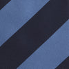View 3 of product The Turnbull & Asser Navy and Blue Block Stripe Repp Silk Tie features wide navy and blue diagonal stripes on luxurious textured silk, elegantly presented against a white background.