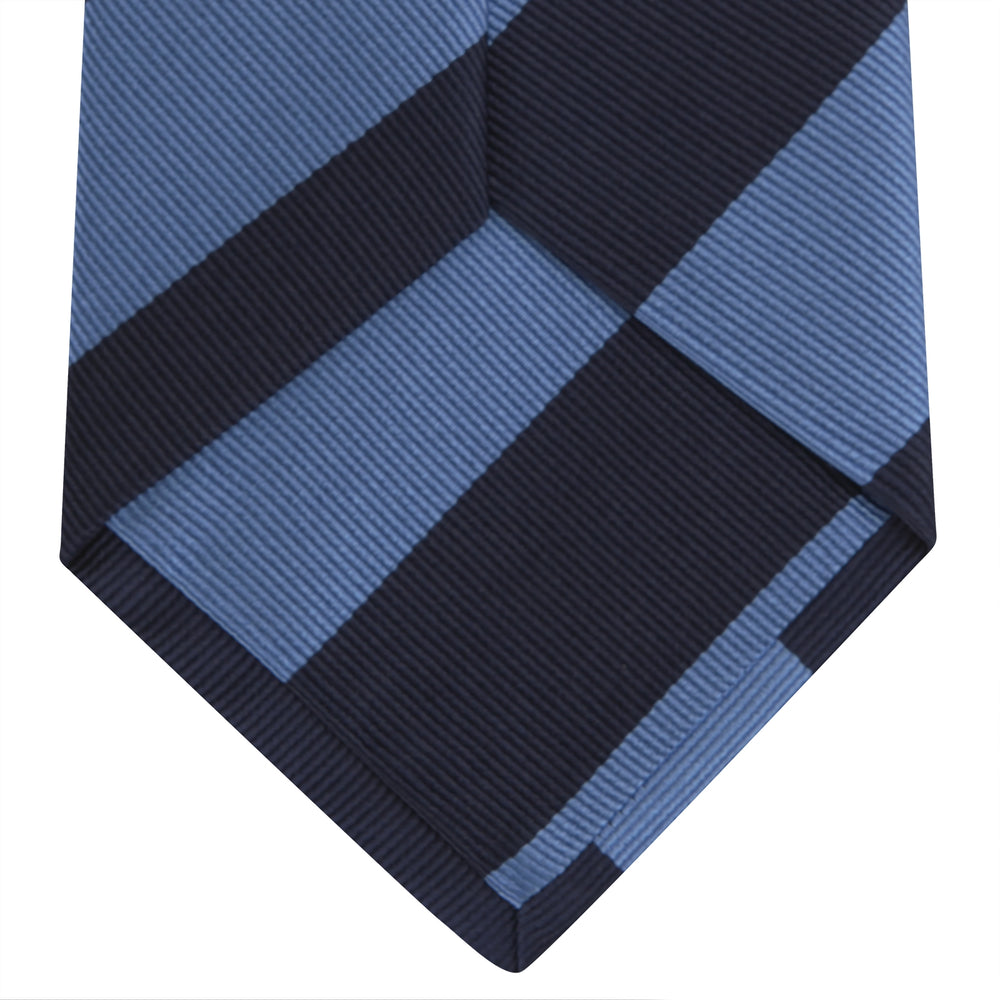 The Turnbull & Asser Navy and Blue Block Stripe Repp Silk Tie features wide navy and blue diagonal stripes on luxurious textured silk, elegantly presented against a white background.