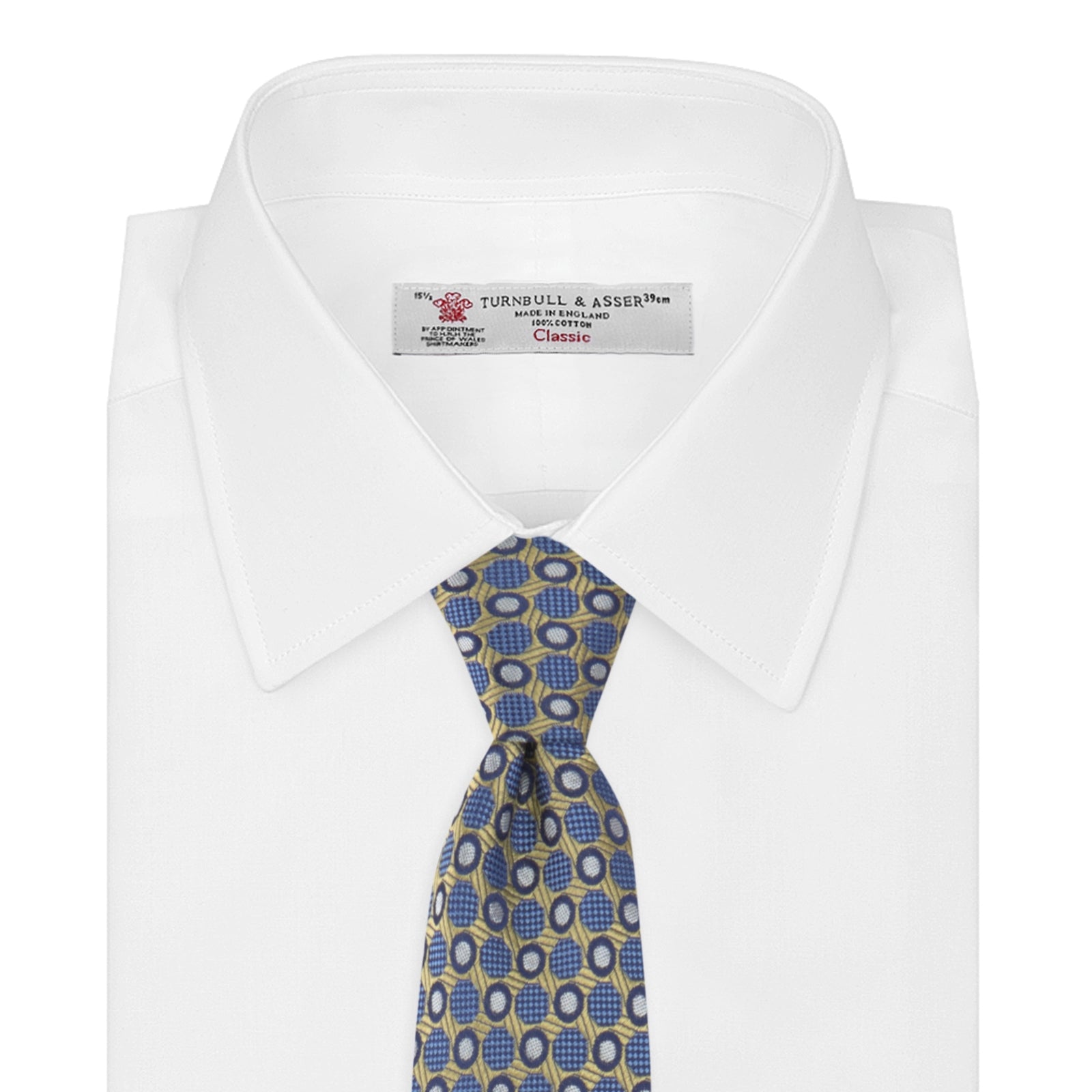 View 2 of product The Gold and Blue Circle and Spot Silk Tie by Turnbull & Asser features blue silk adorned with yellow and white circles and lines, rolled neatly on a light background—an elegant choice for complementing any office shirt.