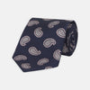 View 1 of product The Turnbull & Asser Navy and Light Pink Floating Paisley Silk Tie features a classic pink and white paisley pattern—a timeless accessory to enhance any wardrobe.