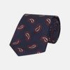 View 1 of product The Turnbull & Asser Navy and Burgundy Floating Paisley Silk Tie is shown rolled up, displaying its repeating paisley design on a plain white background.