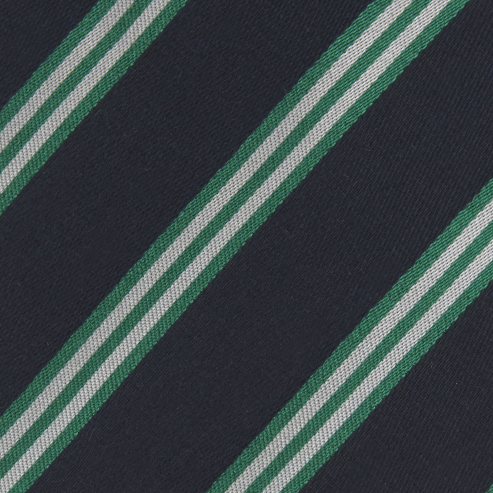 The Turnbull & Asser Navy, Green and White Multi Repp Stripe Silk Tie features elegant diagonal stripes, making it a classic accessory for any occasion. Shown rolled on a white background.