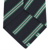 View 4 of product The Turnbull & Asser Navy, Green and White Multi Repp Stripe Silk Tie features elegant diagonal stripes, making it a classic accessory for any occasion. Shown rolled on a white background.
