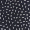 View 3 of product The Turnbull & Asser Navy and White Paint Spot Silk Tie features evenly spaced white spots on classic navy, shown rolled up on a white background—ideal for complementing your favorite office shirt.