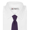 View 2 of product The Turnbull & Asser Plum Grenadine Silk Tie, featuring a textured grenadine weave, is shown rolled up on a plain white background.