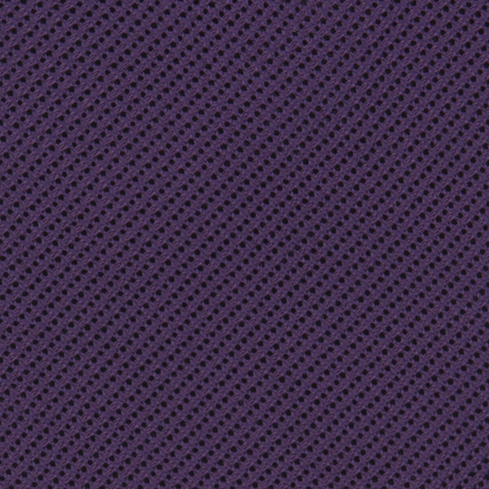 View 3 of product The Turnbull & Asser Plum Grenadine Silk Tie, featuring a textured grenadine weave, is shown rolled up on a plain white background.