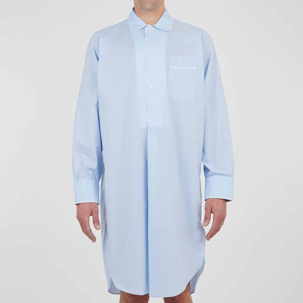 The Turnbull & Asser Sky Blue Micro-Check Cotton Nightshirt features white piping on the collar, button placket, and pocket, a subtle check pattern, and a visible label inside the collar.