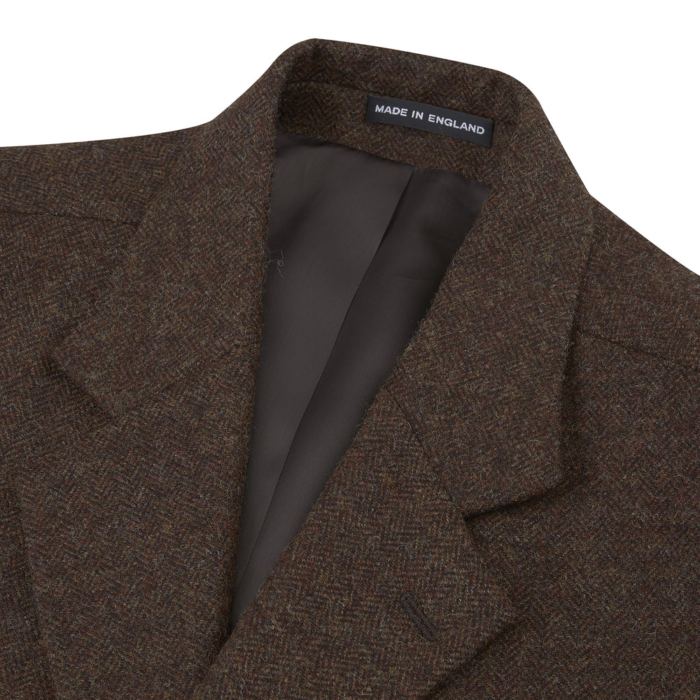 The Hopton Brown Herringbone Wool Coat by Turnbull & Asser is displayed against a white background.