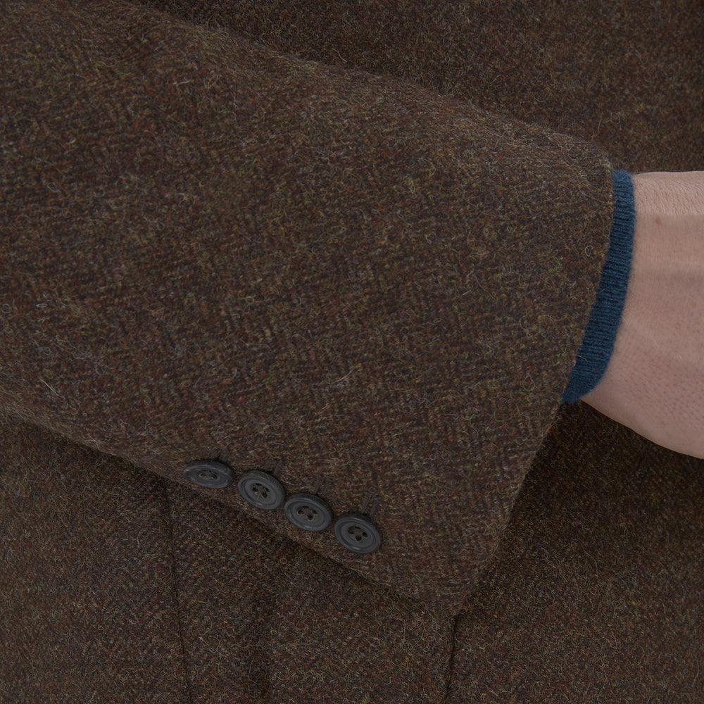 The Hopton Brown Herringbone Wool Coat by Turnbull & Asser is displayed against a white background.