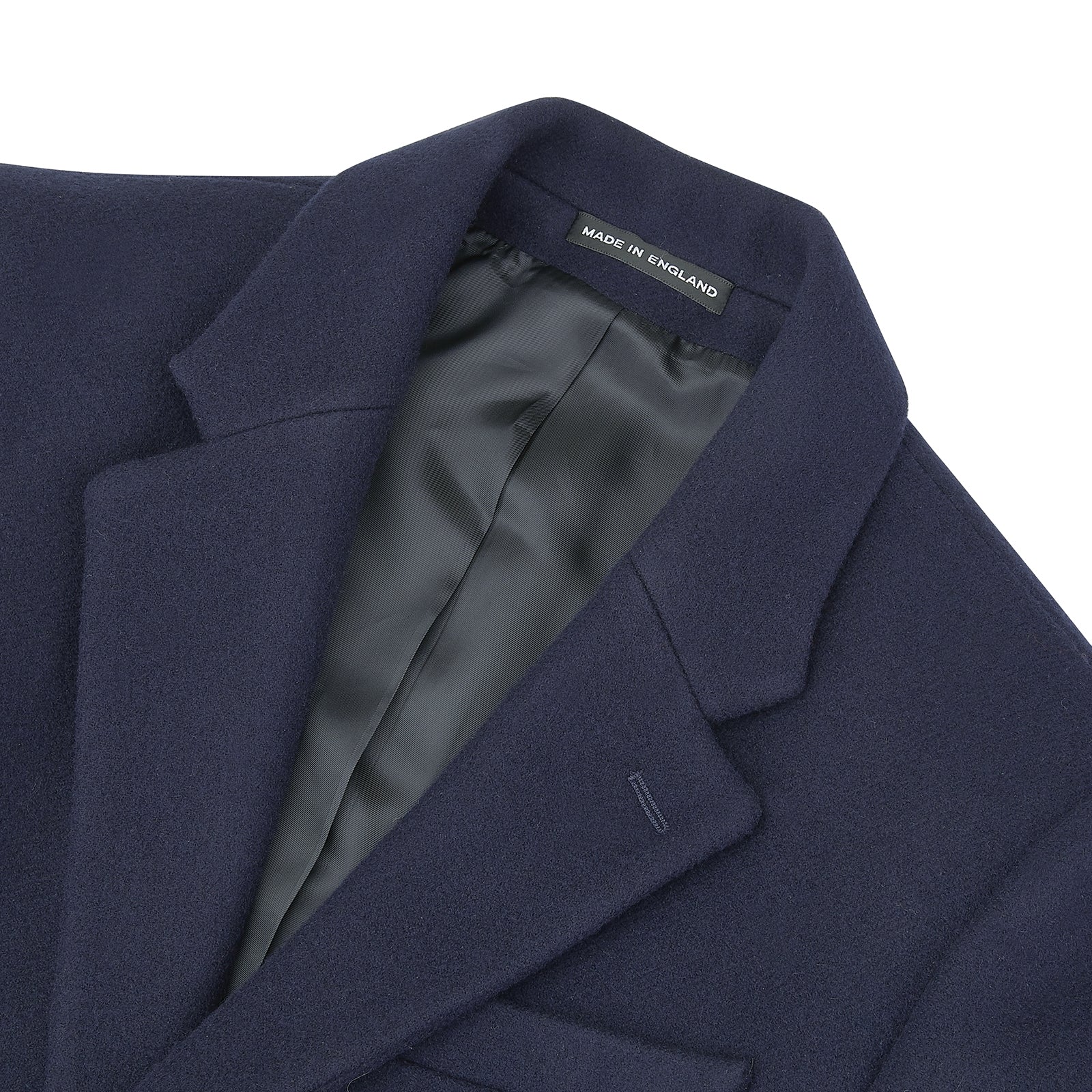 View 5 of product The Turnbull & Asser Navy Lambswool Joseph Overcoat, a men's knee-length coat with notched lapels, a single-breasted front, and three flap pockets per side, is shown against a plain white background.