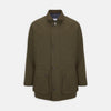 View 1 of product The Turnbull & Asser Dark Green Dry Wax Cotton Field Coat features a front zipper, snap buttons, two large flap pockets, two chest slant pockets, a stand collar, and a classic tailored design in durable dry wax cotton.