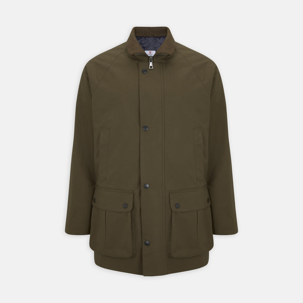 The Turnbull & Asser Dark Green Dry Wax Cotton Field Coat features a front zipper, snap buttons, two large flap pockets, two chest slant pockets, a stand collar, and a classic tailored design in durable dry wax cotton.