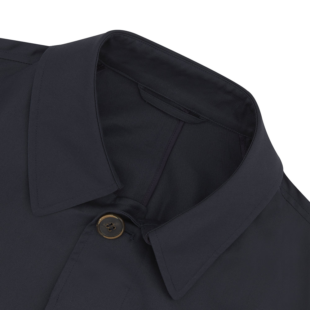 The Navy Cotton Car Coat by Turnbull & Asser features Loro Piana cotton with Rain System technology, a classic collar, concealed buttons, and long sleeves. Shown here in dark navy on a plain white background.