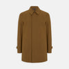 View 1 of product The Turnbull & Asser Dark Khaki Cotton Car Coat features a classic collar, long sleeves, front welt pockets, tailored fit, and concealed button closure in a knee-length modern design, shown against a plain white background.