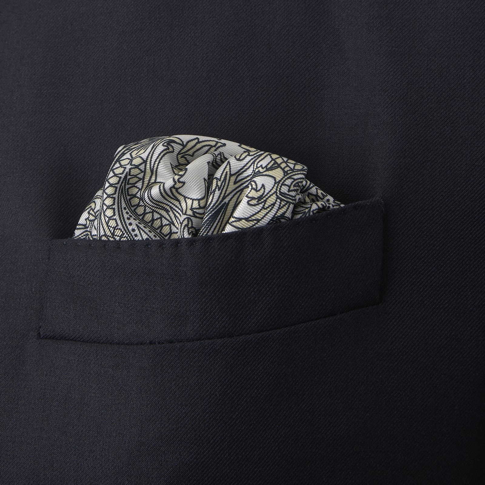 View 4 of product A White and Yellow House Paisley Silk Pocket Square by Turnbull & Asser, featuring an elegant house paisley pattern and the brand name printed in the bottom right corner.