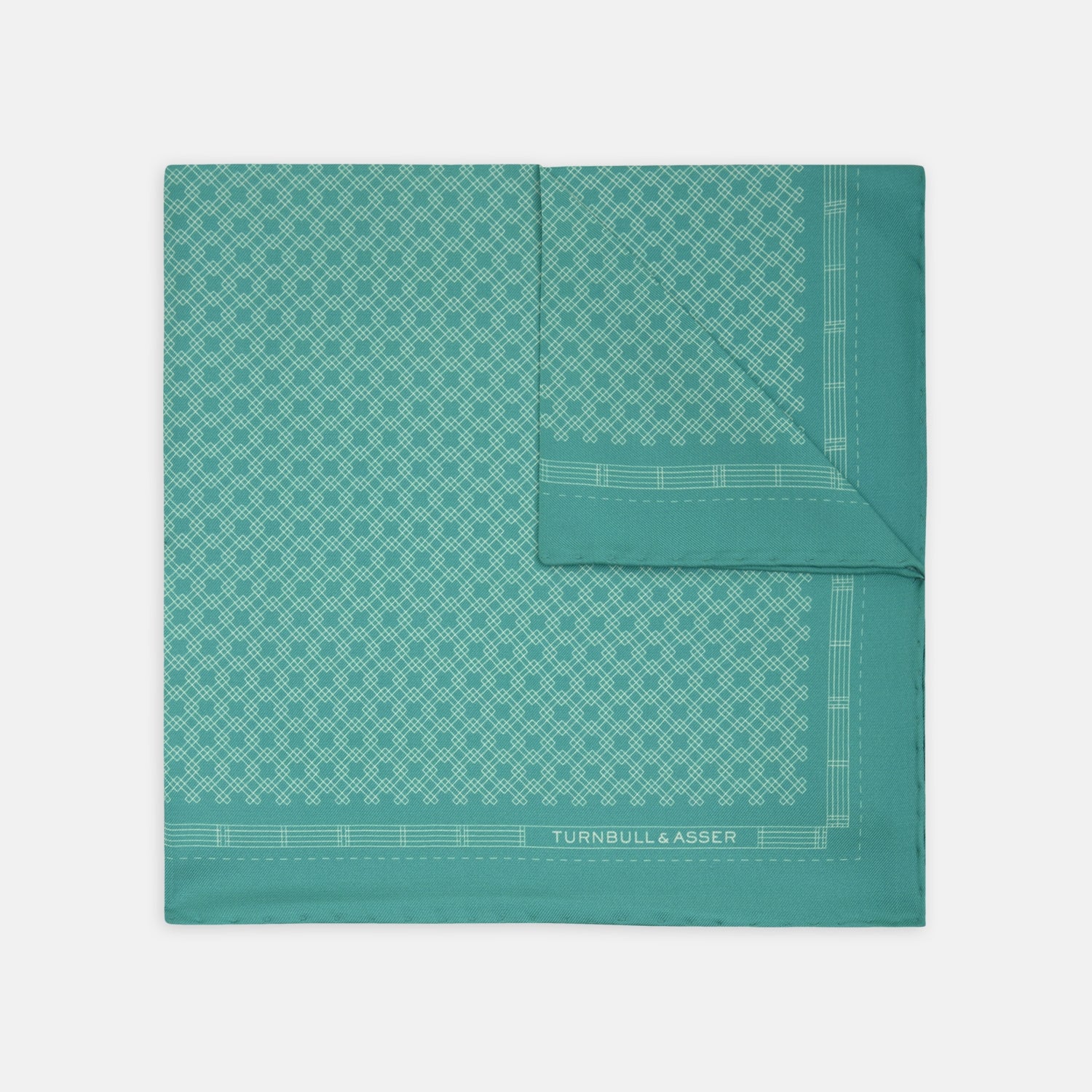 View 1 of product The Kingfisher Green Monocle Silk Pocket Square by Turnbull & Asser features an elegant geometric pattern and border, with the Turnbull & Asser name displayed in white on the lower right corner.