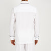 View 3 of product The Turnbull & Asser White Piped Cotton Pyjama Set, made from Egyptian cotton and featuring black piping and two buttons, is shown folded with a matching white tie-strap face mask on a light gray background.