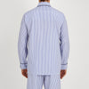 View 3 of product The Turnbull & Asser Blue Bengal Stripe Piped Cotton Pyjama Set, featuring a folded top with white buttons beside matching bottoms, is displayed on a plain light background.