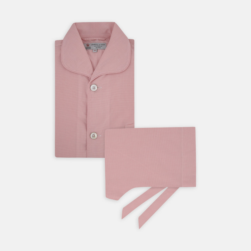The Turnbull & Asser Pink Micro-Check Piped Cotton Pyjama Set, featuring a pink button-up top with white buttons and a matching headscarf, is displayed on a white background.