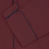 View 4 of product The Wine Piped Silk Pyjama Set by Turnbull & Asser features a folded maroon top with white buttons and dark trim, displayed beside a matching sleep mask with tie straps, set against a plain white background.
