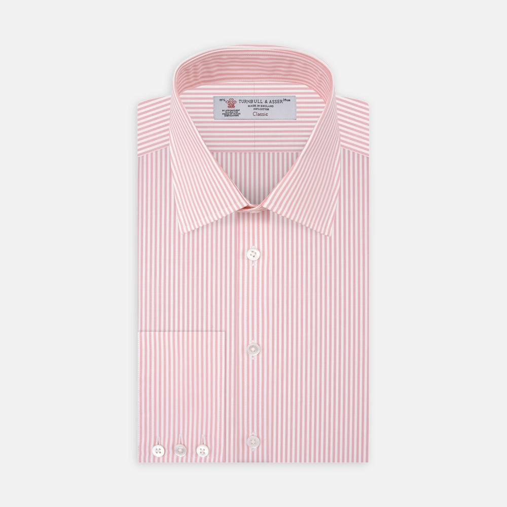 Close-up of Turnbull & Asser's Pink Bengal Stripe Cotton Fabric, featuring pink and white vertical stripes within a circular frame on a white background. A seam appears near the right edge of the fabric.