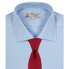 View 4 of product A neatly folded Burgundy Corduroy Cotton Shirt by Turnbull & Asser, featuring a Cambridge collar and 3-button cuffs, displayed against a plain white background.