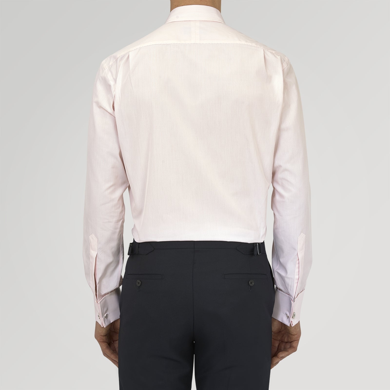 View 3 of product The Turnbull & Asser Pink Hairline Stripe Cotton Shirt features a T&A collar, double cuffs, neat vertical stripes, white buttons, and a chest pocket—perfect for the office. Shown neatly folded on a plain white background.