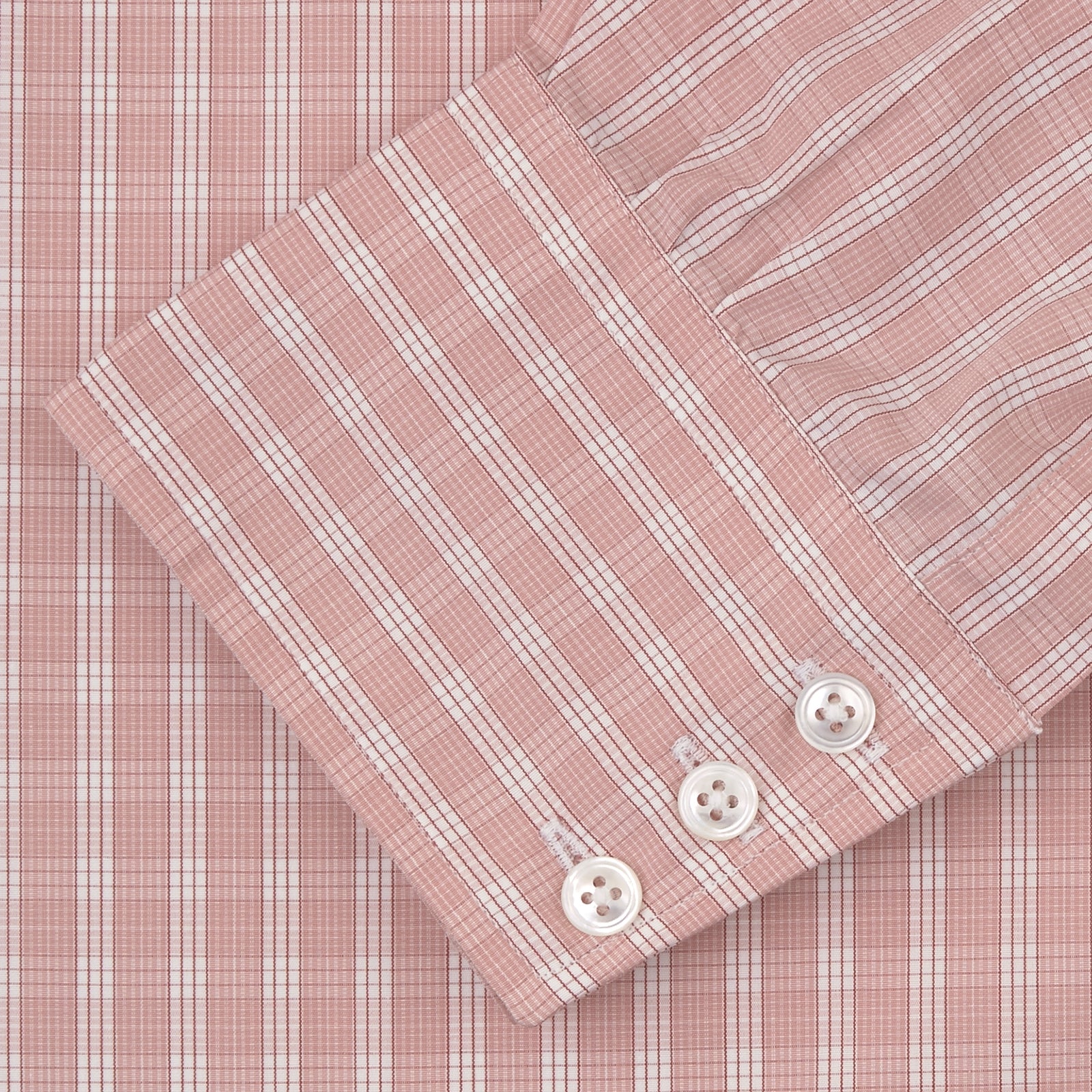 View 2 of product The Turnbull & Asser Pink and White Bold Check Shirt features a T&A collar and 3-button cuffs, displayed folded on a plain white background.