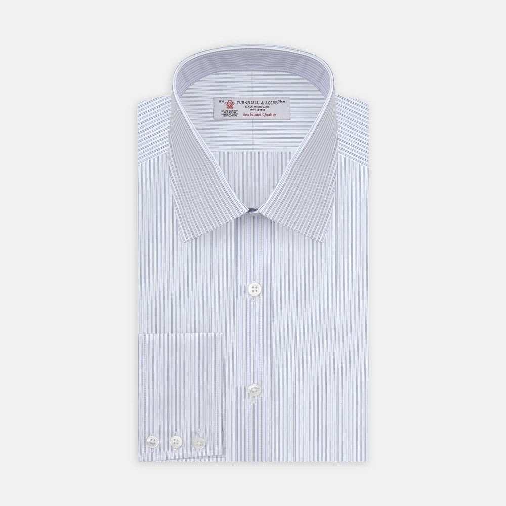 A close-up of Light Blue Double Stripe Sea Island Quality Cotton Fabric by Turnbull & Asser, showing thin vertical stripes within a circular frame on a plain background.