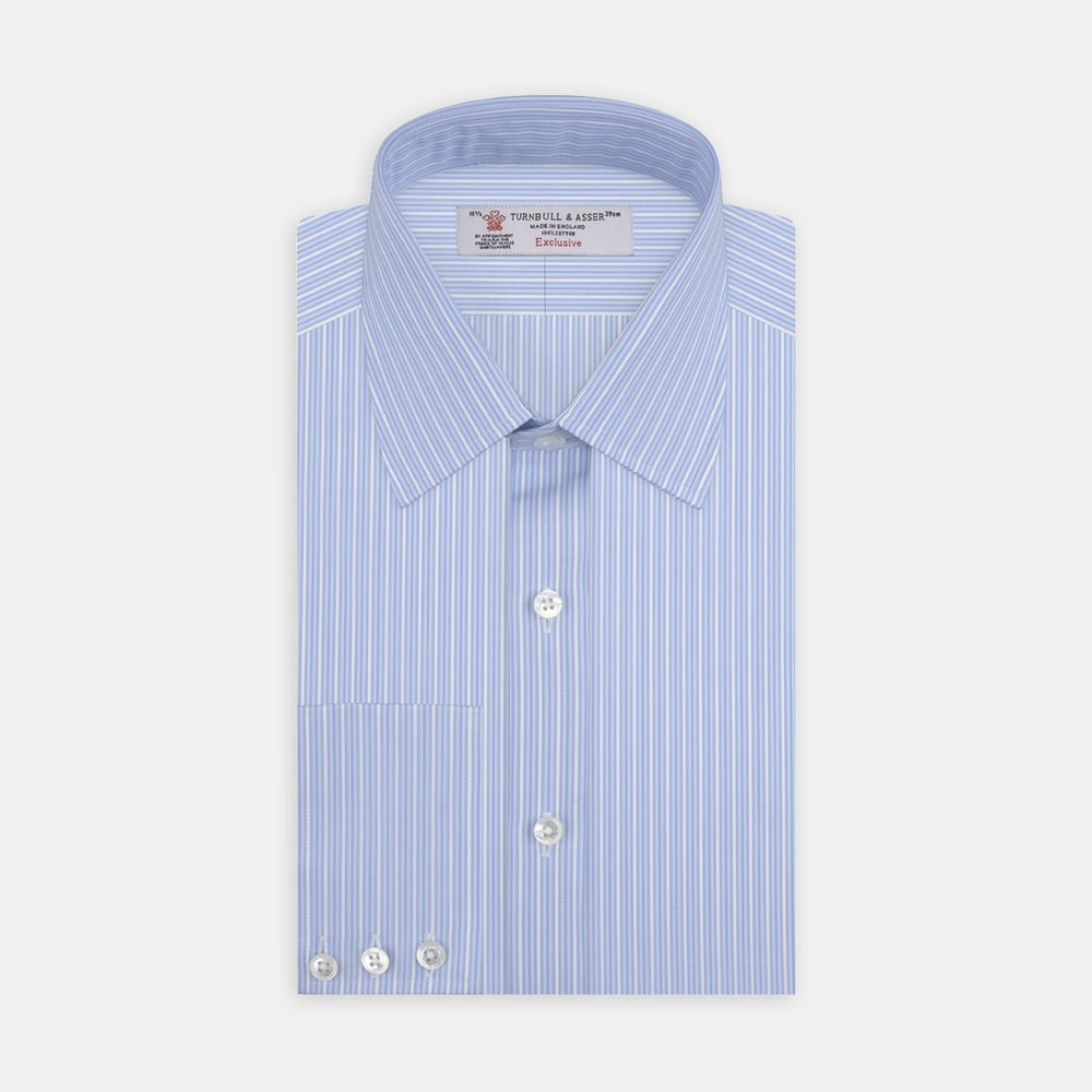A close-up of Turnbull & Asser’s Light Blue Rich Stripe Cotton Fabric, featuring alternating light blue and white vertical stripes, framed by a circular gray border on a plain white background.