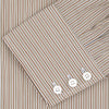 View 4 of product The Turnbull & Asser Tailored Fit Brown Fine Stripe Shirt features a Bury collar, 3-button cuffs, white buttons, and fine brown and white stripes. Made from premium Thomas Mason cotton and shown neatly folded on a plain white background.