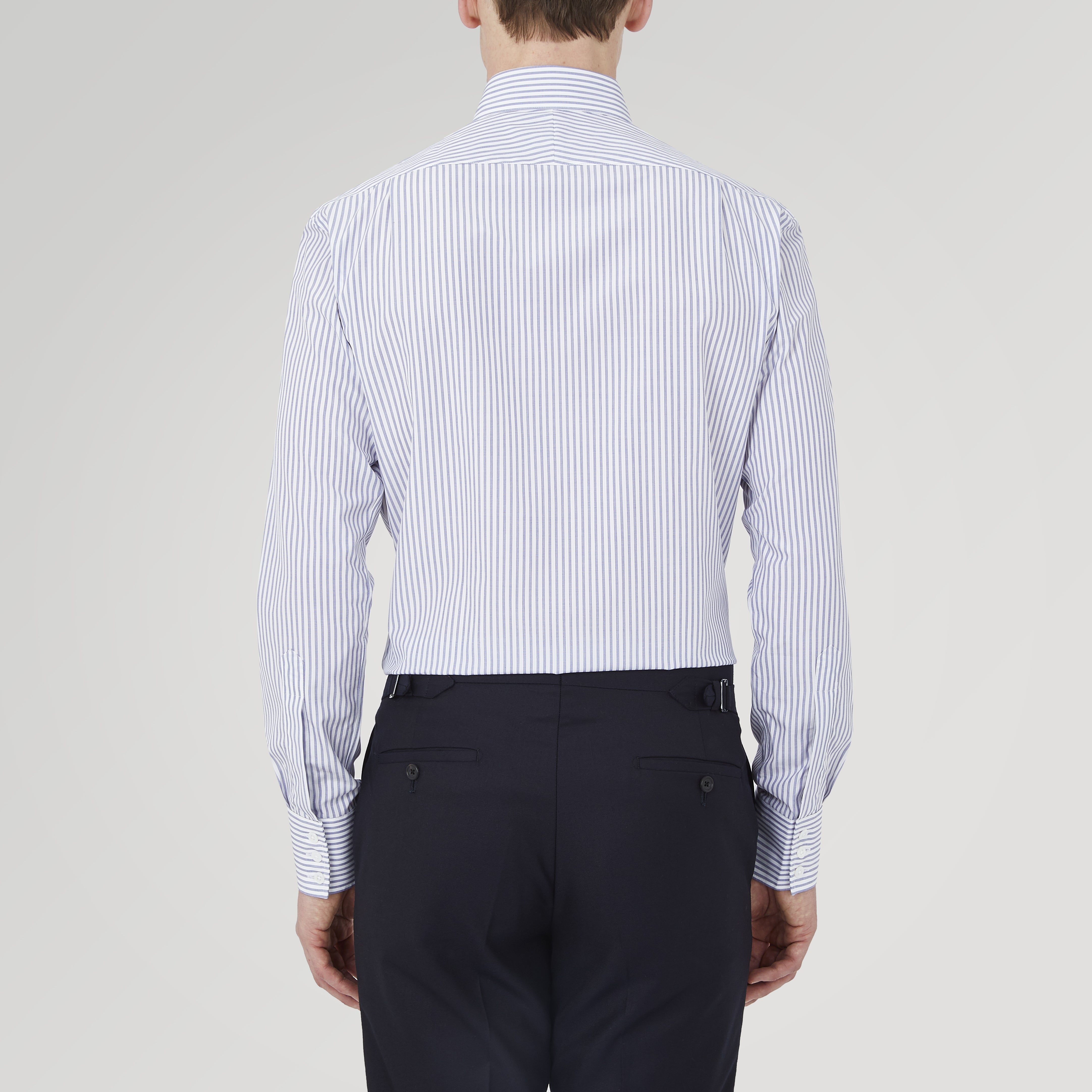 View 3 of product The Turnbull & Asser Tailored Fit Blue and White Stripe Sea Island Quality Cotton Shirt features a Bury collar and 3-button cuffs, neatly folded with white buttons, shown on a plain white background.