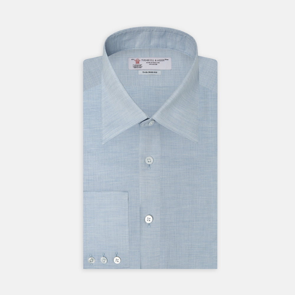 A neatly folded Tailored Fit Light Blue Flannel Shirt by Turnbull & Asser with a Bury collar and 3-button cuffs, displayed on a plain white background, features an inner collar label.