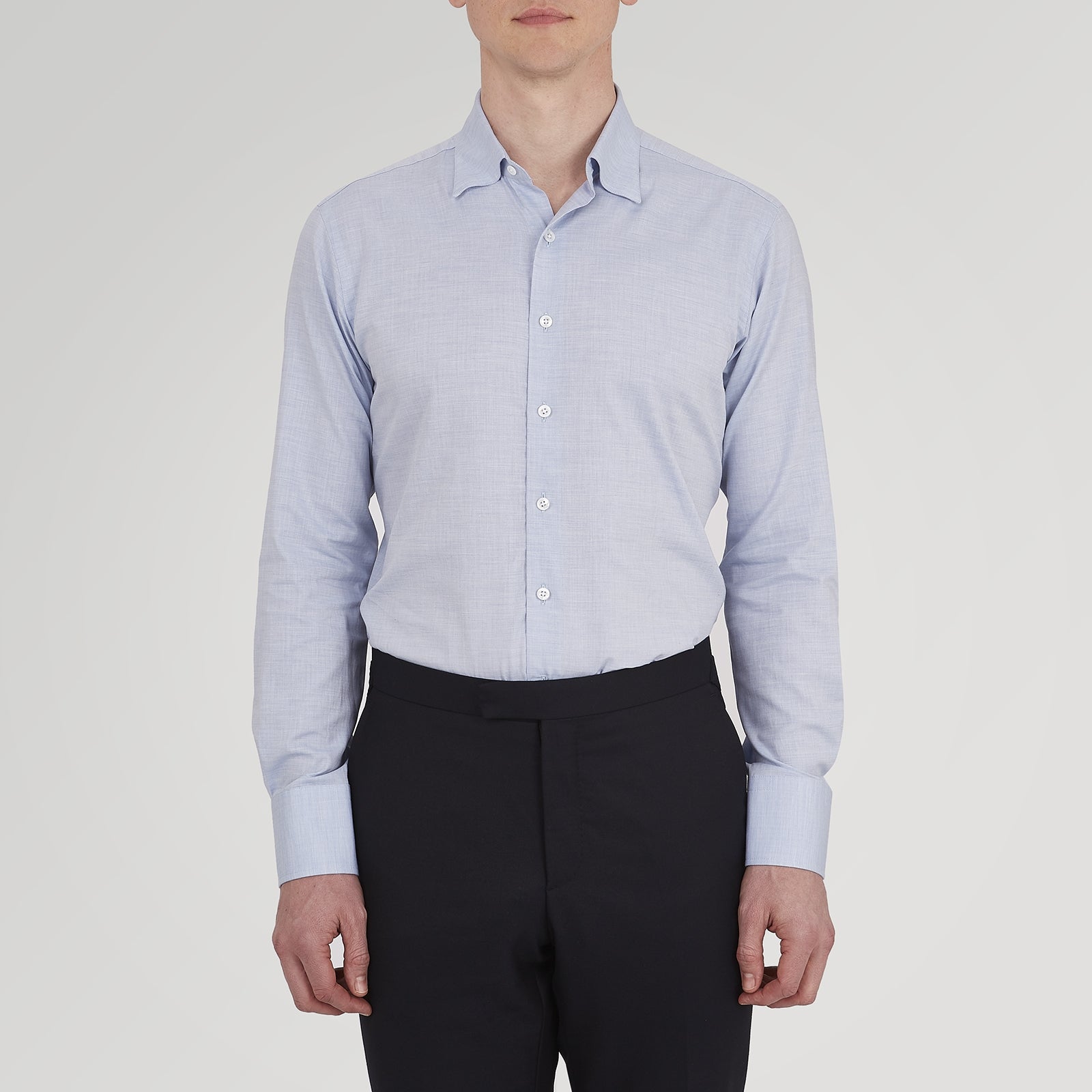 View 3 of product A neatly folded Tailored Fit Light Blue Flannel Shirt by Turnbull & Asser with a Bury collar and 3-button cuffs, displayed on a plain white background, features an inner collar label.
