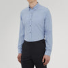 View 2 of product The Turnbull & Asser Weekend Fit Blue Cashmerello Light Shirt features a Dorset collar, 1-button cuffs, subtle check pattern, front pocket, and white buttons—softly folded on a white background.