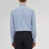 View 3 of product The Turnbull & Asser Weekend Fit Blue Cashmerello Light Shirt features a Dorset collar, 1-button cuffs, subtle check pattern, front pocket, and white buttons—softly folded on a white background.